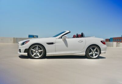 Wide angle side shot of the Mercedes-Benz SLK-Class vehicle with a blue sky background