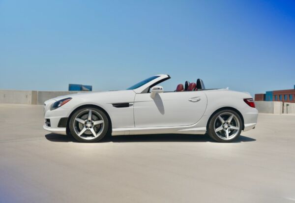 Wide angle side shot of the Mercedes-Benz SLK-Class vehicle with a blue sky background
