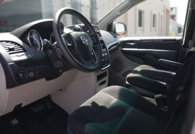 Interior shot of the Dodge Grand Caravan displaying the dashboard and steering wheel.