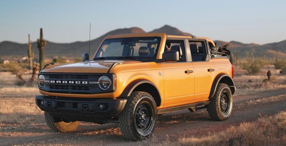 Frontal angled shot of the Ford Bronco with mountains in the background and the vehicle facing left.