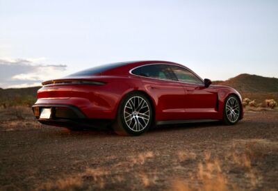 rear angle shot of the Porsche Taycan at dusk