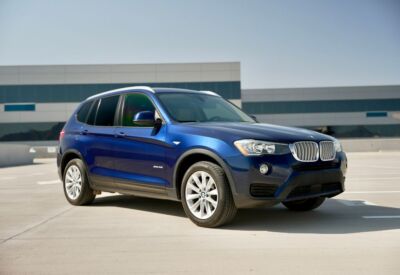 BMW X3 medium wide shot facing right.