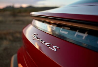 Close up shot of the rear emblem of the Porsche Taycan