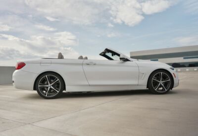 Wide shot of the BMW 4-Series Convertible facing right.
