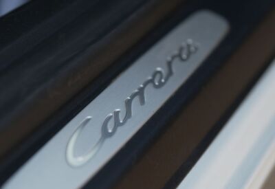 Close up shot of the Porsche 911 logo
