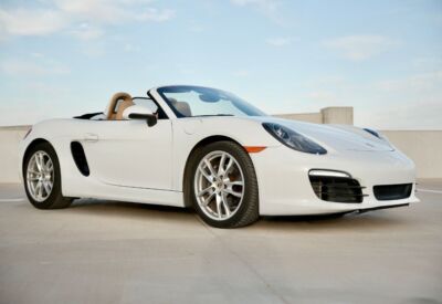 front angle shot of the Porsche Boxster facing right in a parking lot