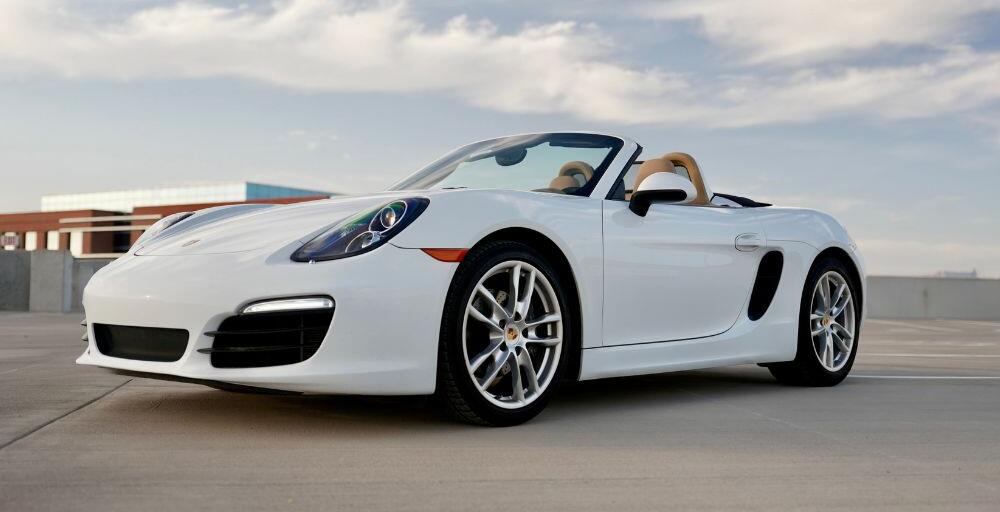 front angled shot of the Porsche Boxster facing left in a parking lot