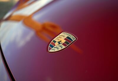 Close up shot of the Porsche Taycan emblem