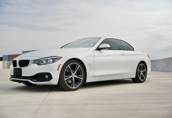 Medium wide shot of a BMW 4-Series Convertible available through High Flying Rentals.