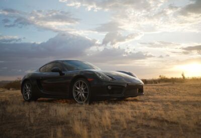 front angle shot of the Porsche Cayman facing right