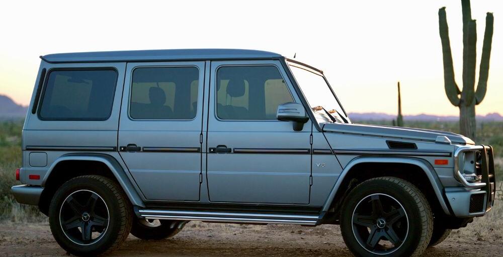 Medium wide shot of the Mercedes Benz G-Wagon facing right