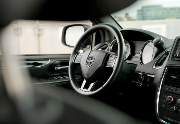 Interior shot of the Dodge Grand Caravan focusing on the driver's side steering wheel area