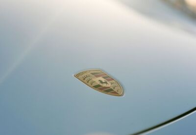 Close up shot of the Porsche 911 hood emblem