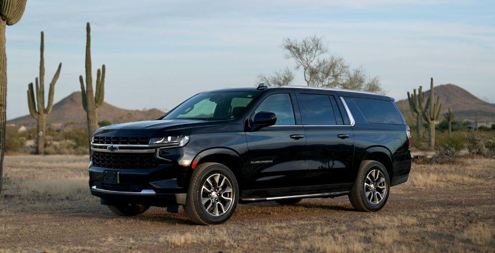 Frontal angle shot of the Chevrolet Suburban with mountains in the background.