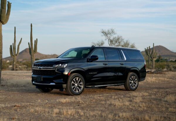 Frontal angle shot of the Chevrolet Suburban with mountains in the background.