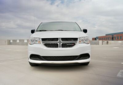 Frontal angle of the Dodge Grand Caravan with blue skies in the background