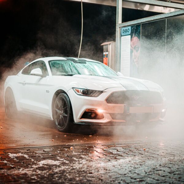 Luxury car going through the car wash.