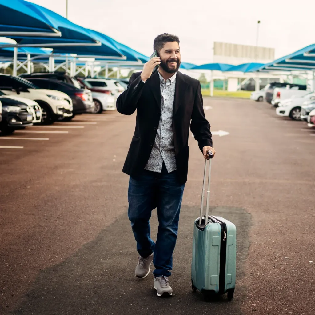 Man dropping off his car at the airport.